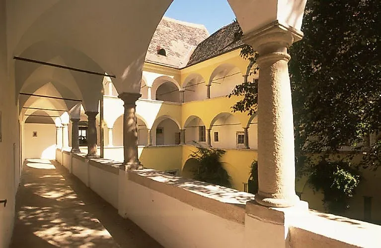 Inner courtyard of Palais Herberstorff in Bad Radkersburg with historic architecture and arcades.