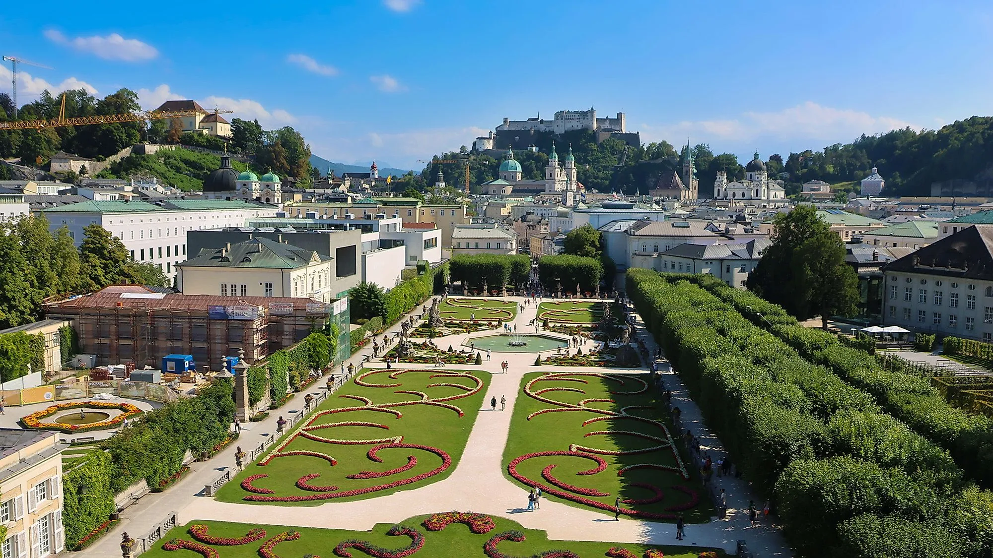 Panoramic view over the Mirabell Gardens with a view of Salzburg's old town and Hohensalzburg Fortress.