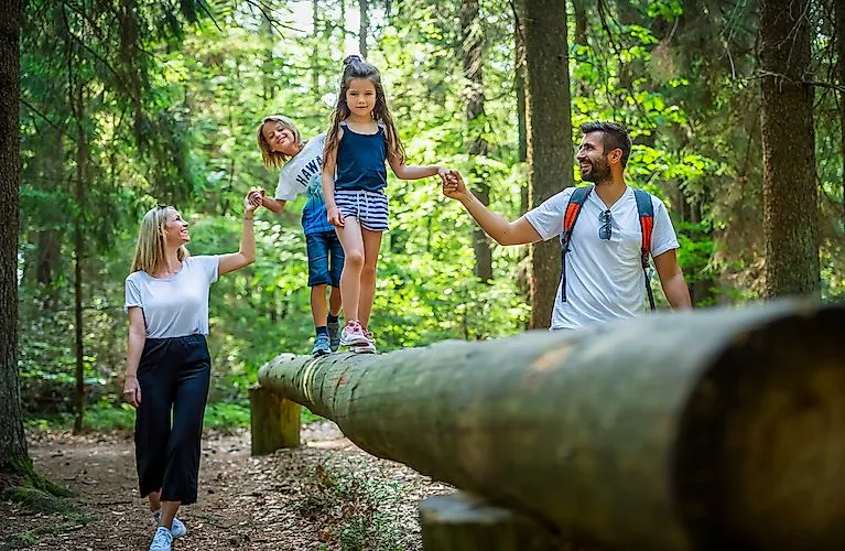 Family on the circular lake trail in the Ilz valley in a wonderful landscape