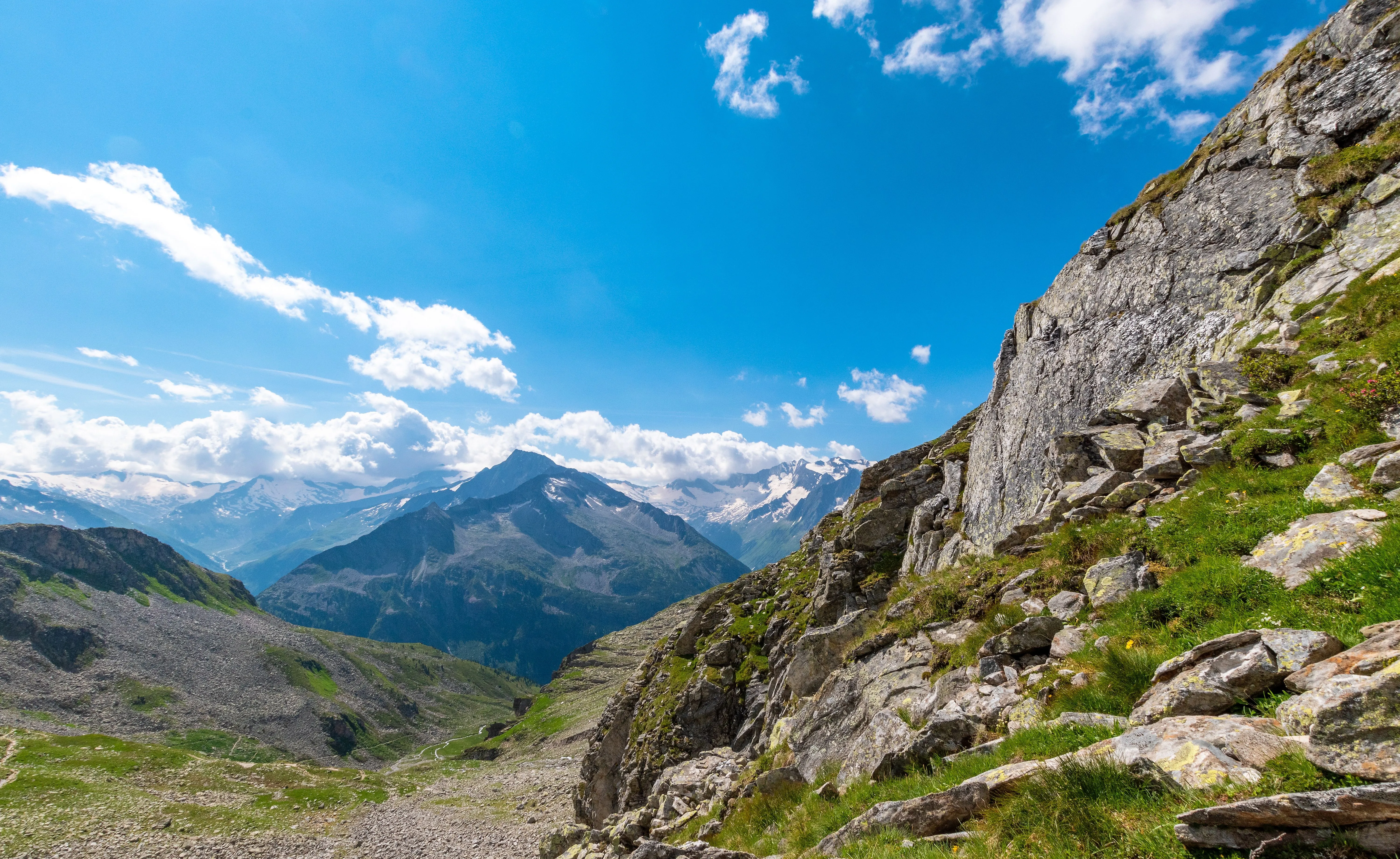 Mountain landscape with hiking trail and panoramic view in Mayrhofen in the Zillertal in summer weather.