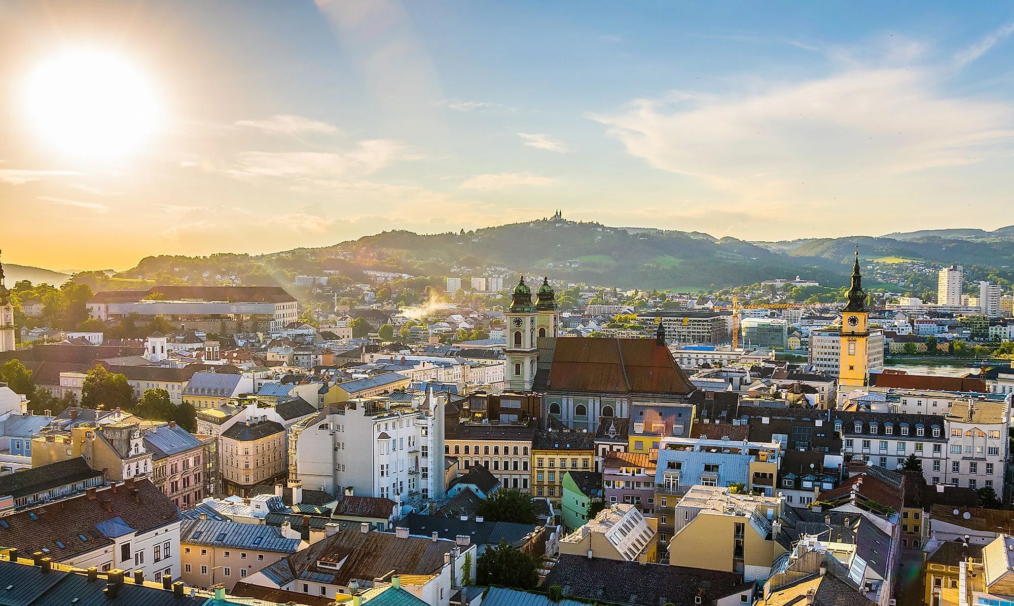 Panorama of Linz with St. Mary's Cathedral, old town and Pöstlingberg in the sunlight