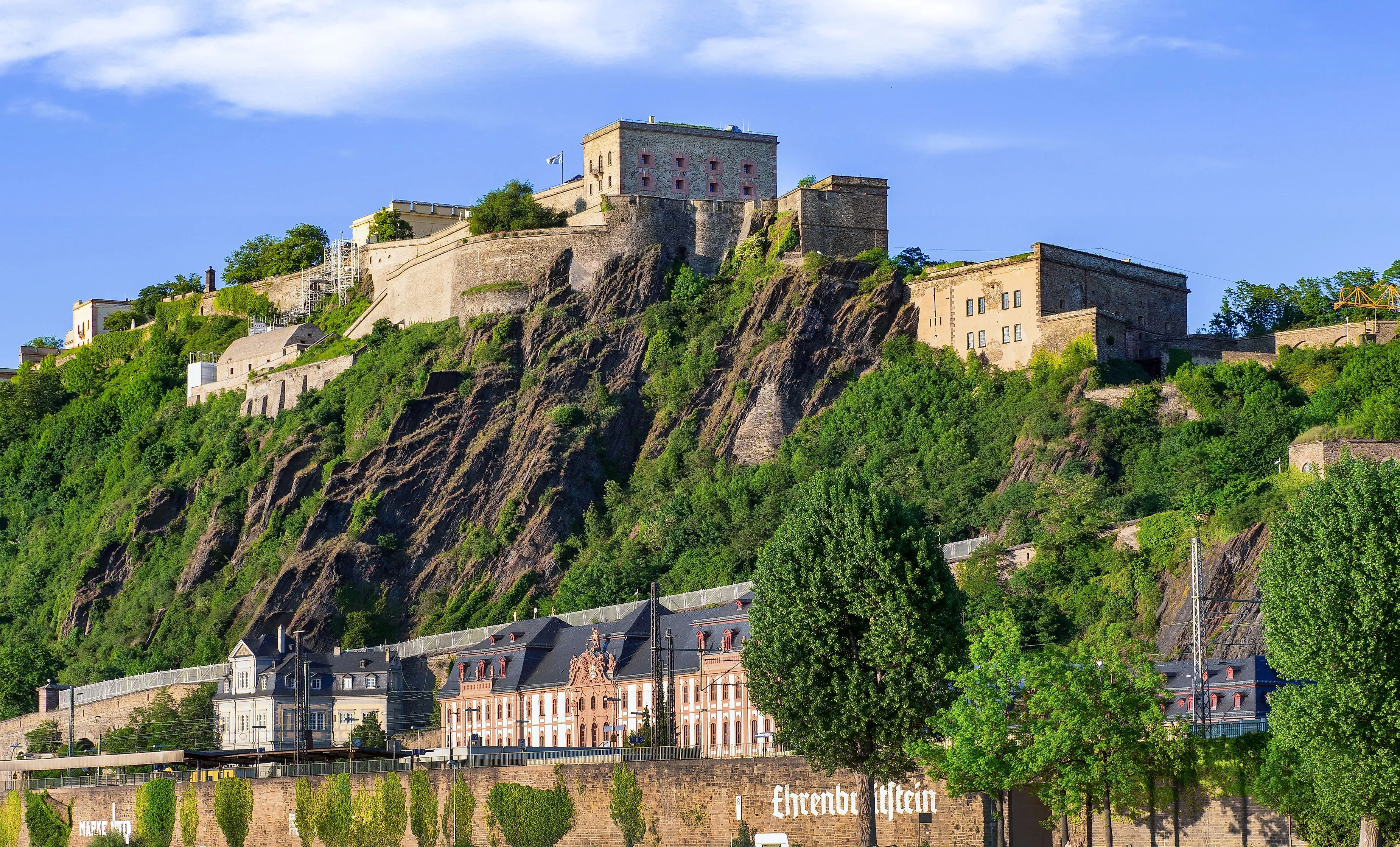 View of the Ehrenbreitstein fortress in Koblenz on a steep cliff above the Rhine.