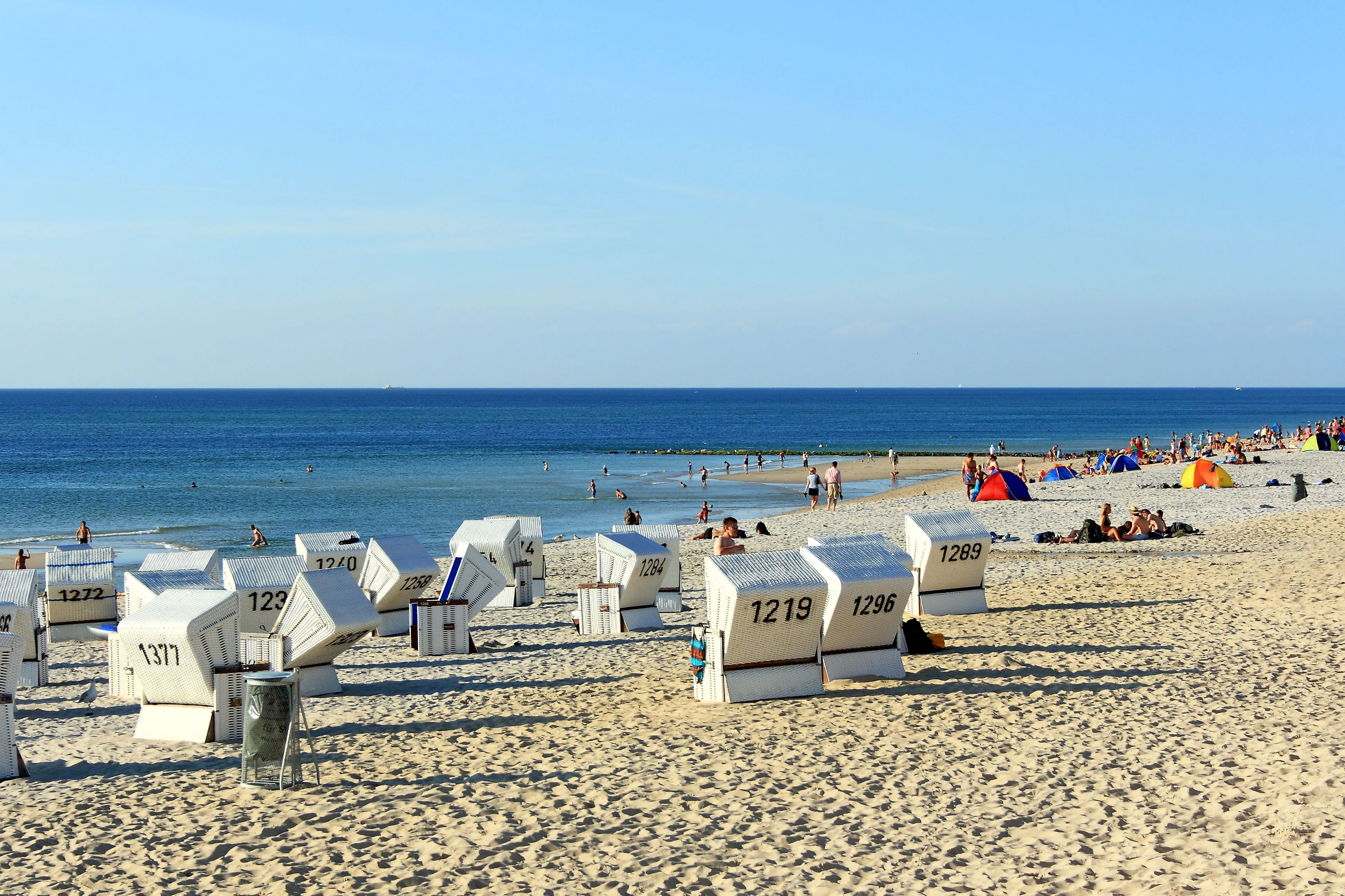 Westerland Beach on Sylt, with beach chairs, swimmers, and a view of the North Sea