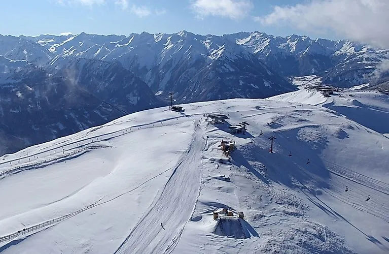 Winter mountain landscape with ski slopes and lifts in the Wildkogel Arena