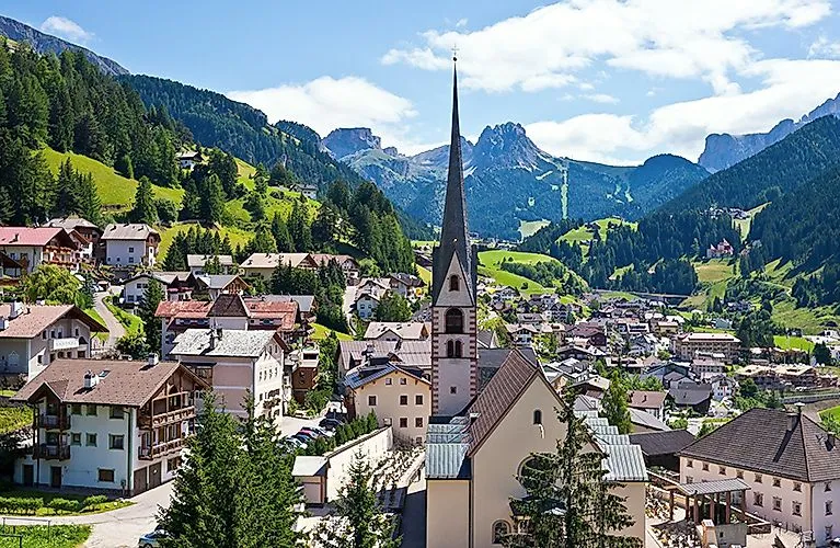 Summer panorama of S. Cristina in Val Gardena with a view of the Dolomites in the background.